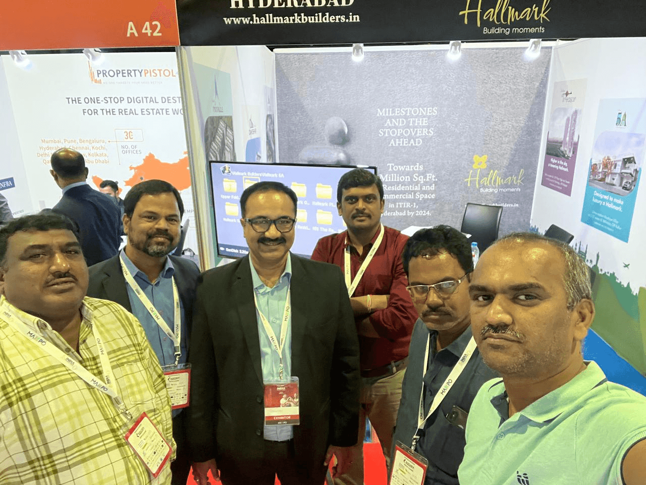 Sanjay Pan with colleagues at the Hallmark Builders exhibition booth