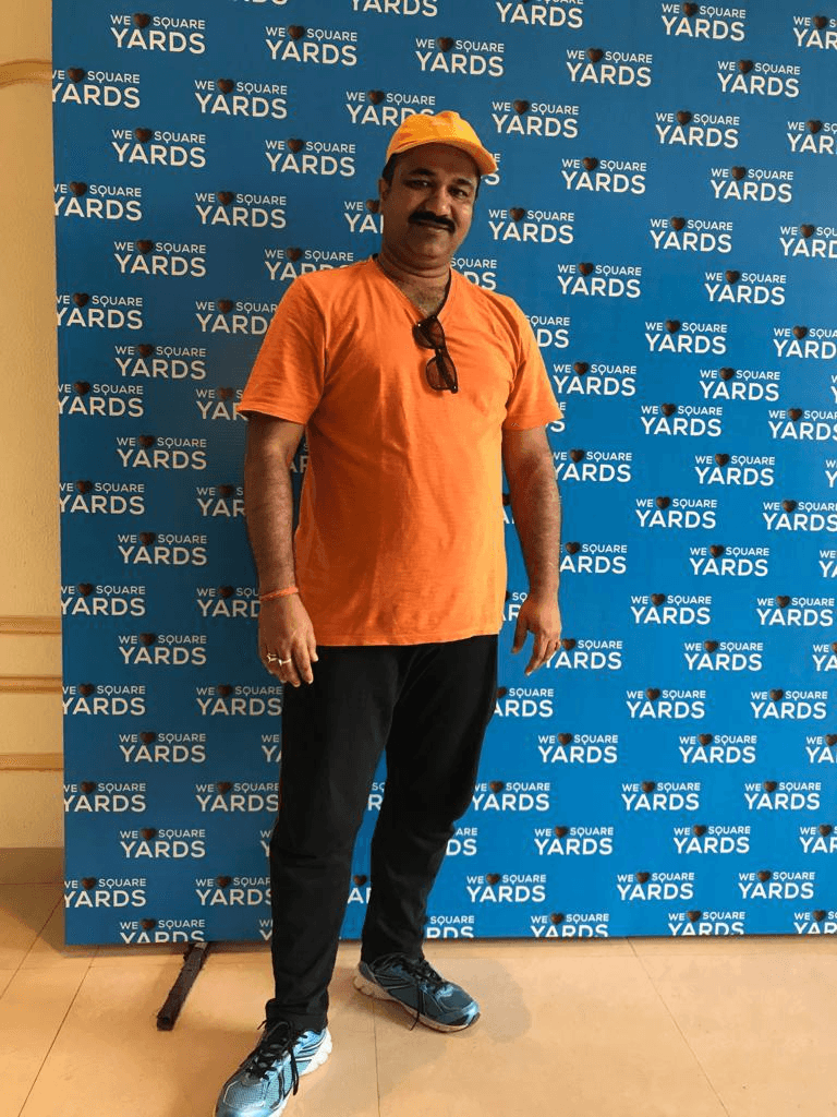 Sanjay Pan at a Square Yards event backdrop